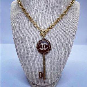 Authentic Chanel button, used to create a new necklace.